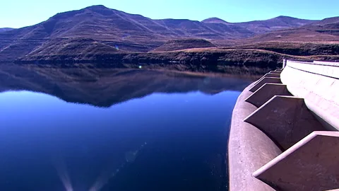 Mountainous landscape reflected of the Katse Dam in Lesotho Stock Footage 310318424
