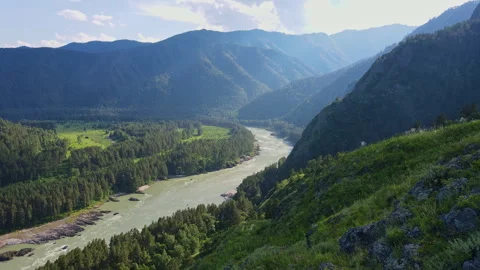 Mountainous landscape with river and forest Stock Footage 246591150
