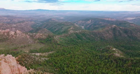 Mountainous panorama on cloudy daytime. Drone footage over the rocky landscape Stock Footage 213328771