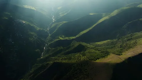 Mountainous Terrain with Light and Shadow Play. Play of light and shadow over Stock Footage 265592542