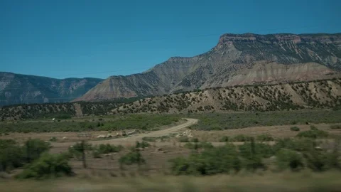 Mountainous terrain view from a car 스톡 동영상 79851847