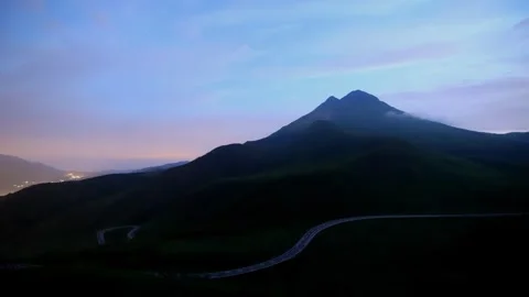 Mountains and car light trails in the early hours Stock Footage 341952842