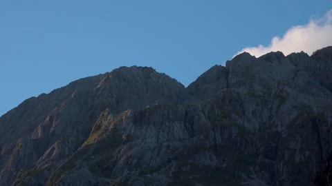 Mountains and cliffs with green trees in New Zealand Milford Sound Stock Footage 132062861