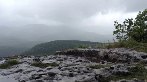 Mountains and clouds and a tree after rain at Mangup Kale - Crimea , Russia Stock Footage 73765960