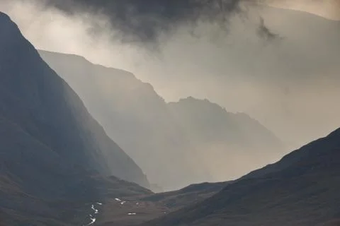 Mountains and clouds Stock Photos