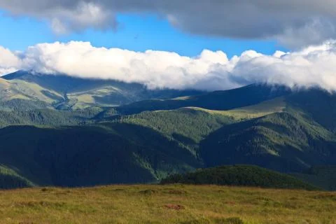 Mountains and clouds Stock Photos