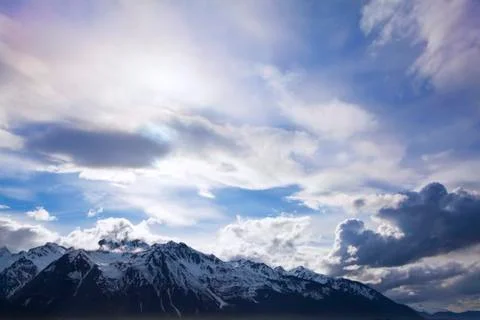 Mountains and clouds Stock Photos