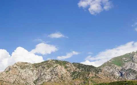 Mountains and clouds Stock Photos