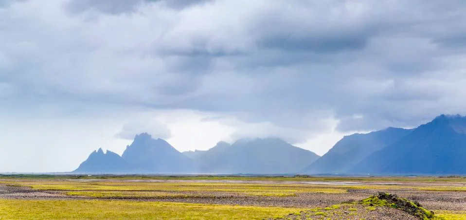 Mountains and dark clouds Stock Photos