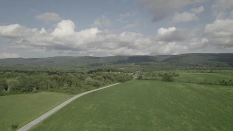 Mountains and Field Tracking Left Stock Footage 247680772