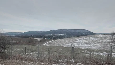 Mountains and Fields with Fence, Winter Stock Footage 76451197