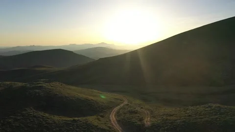 Mountains and fields at sunset Stock Footage 294166647