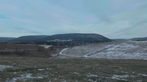 Mountains and Fields in Winter by highway Stock Footage 76442288