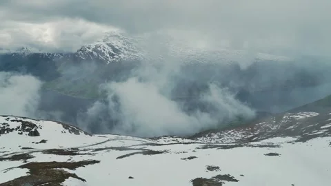 Mountains and Fiord in the clouds over Olden, Innvikfjorden, Norway Stock Footage 242594760