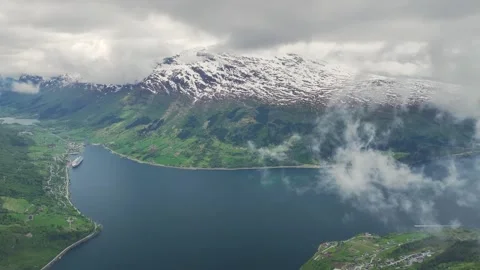 Mountains and Fiord in the clouds over Olden, Innvikfjorden, Norway Stock Footage 242595732