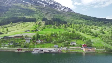 Mountains and Fiord in the clouds over Village, Olden, Innvikfjorden, Norway 動画素材 242632253