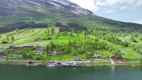 Mountains and Fiord in the clouds over Village, Olden, Innvikfjorden, Norway 스톡 동영상 242632255