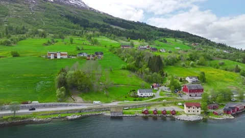 Mountains and Fiord in the clouds over Village, Olden, Innvikfjorden, Norway 스톡 동영상 242634129