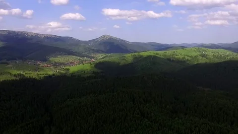 Mountains and Forest. Aerial View. Blue sky. fluffy clouds Stock Footage 74237353