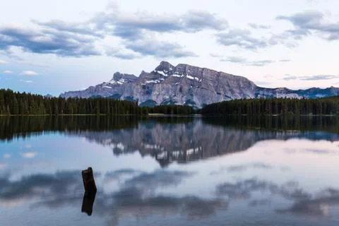 Mountains and forests reflected in Two Jack Lake Stock Photos