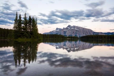 Mountains and forests reflected in Two Jack Lake Stock Photos