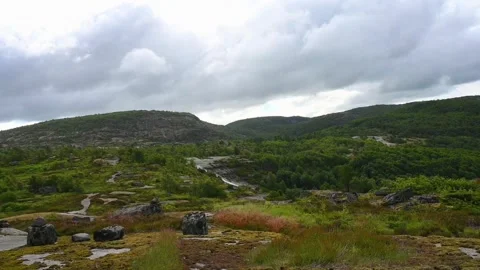 Mountains and hills under cloudy sky in Norway during summer with green tre.. Stock Footage 340212923