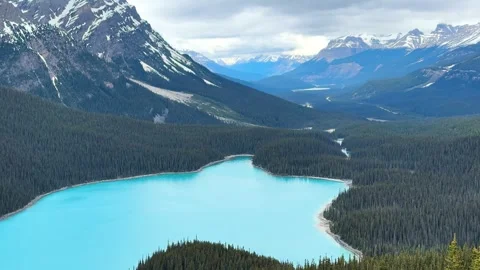 Mountains and lake view from high ground in Canada on a cloudy day. Peyto lake. Stock Footage 338282593