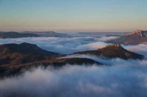 Mountains and low clouds in the evening Stock Photos