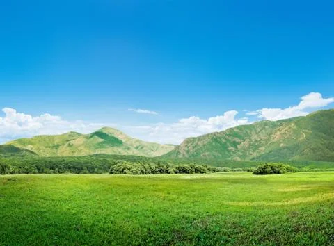 Mountains and meadow Stock Photos
