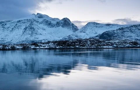 Mountains and reflection on the water surface Stock Photos