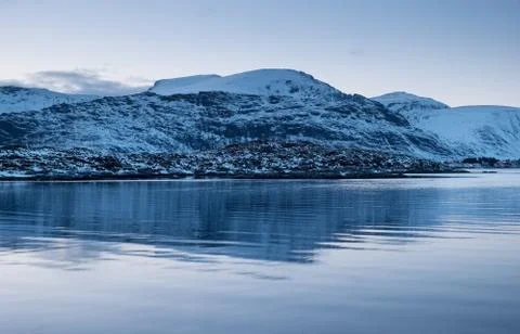 Mountains and reflection on the water surface Stock Photos