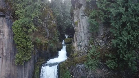 Mountains and River Flow into Waterfall Drone Stock Footage 99125467