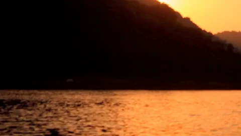 Mountains and river flowing against the sunset Video stock 102779183