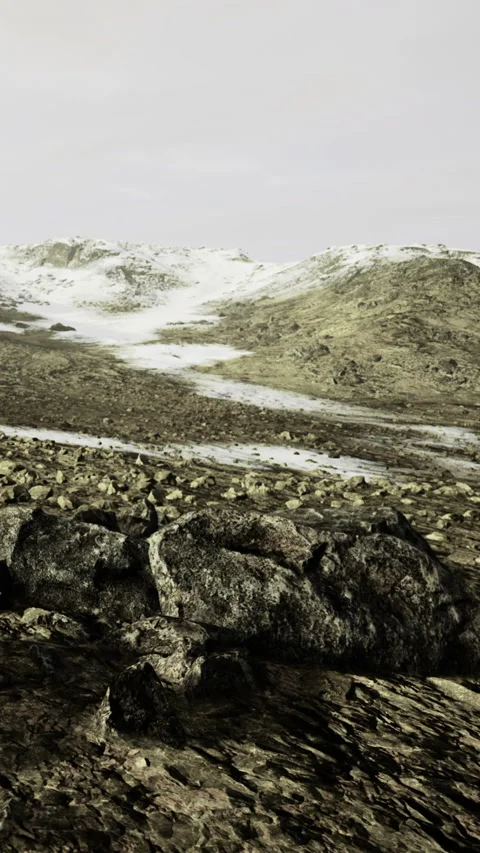 Mountains and rocks in a remote area with snow patches during cloudy weather Stock Footage 334262914
