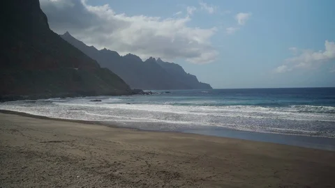 Mountains and sandy beach of the Atlantic Ocean on the island of Tenerife. Stock Footage