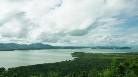 Mountains and the sea with clouds moving quickly because of the strong wind. Stock Footage 253435691