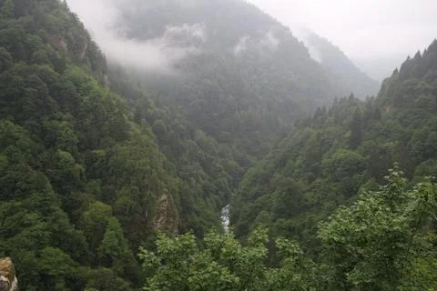 Mountains and stream Stock Photos