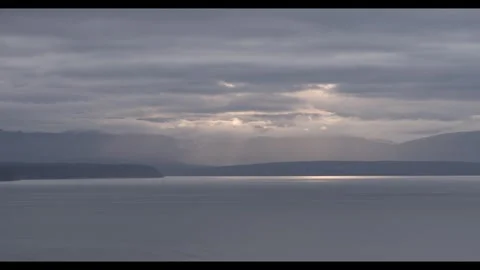 Mountains and sun over a silver sea Stock Footage 296517570