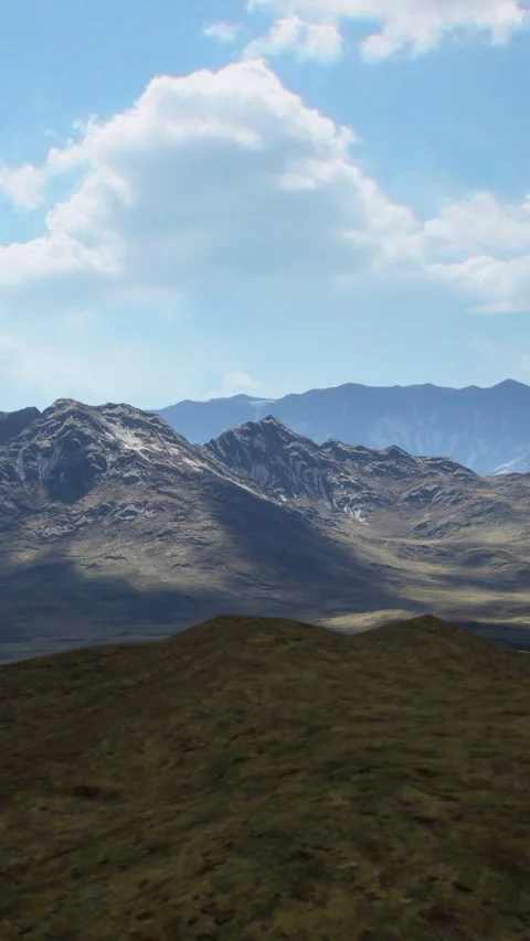Mountains and valleys stretch under a partly cloudy sky in this landscape scene Stock Footage 341030585