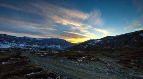 Mountains and valleys time lapse of puffy white clouds, blue skies and cloud sha Stock Footage 53124212