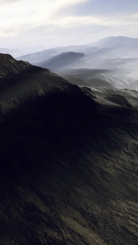 Mountains and valleys under a cloudy sky during the day 库存影片 336009485