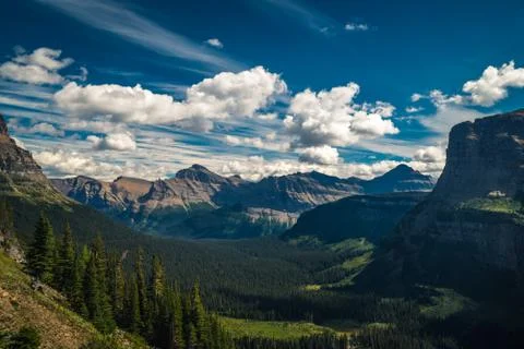 Mountains and valleys under moving clouds. Stock Photos