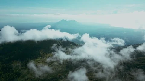 Mountains and volcanoes in the clouds Video stock 294942652
