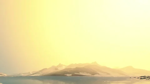 Mountains and water under bright sky during late afternoon in nature setting 動画素材 340630144
