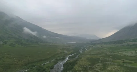 Mountains and wild stream in the clouds. Subpolar Ural. Uralic Mountains Stock Footage 269154229