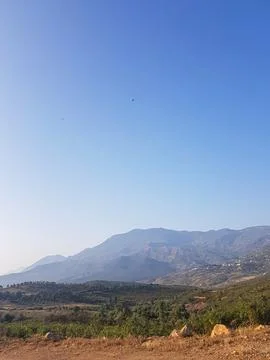 Mountains are covered in the sun rays Stock Photos