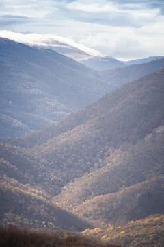 Mountains, autumn forest, clouds Stock Photos