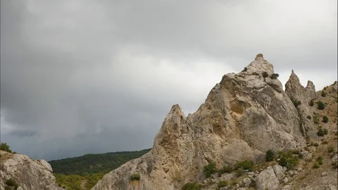 Mountains in the background of gray clouds. Dark clouds envelop the tops of the Stock Footage 96533622