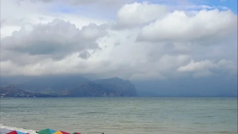 Mountains in the background of gray clouds. Dark clouds envelop the tops of the Stock Footage 97186471
