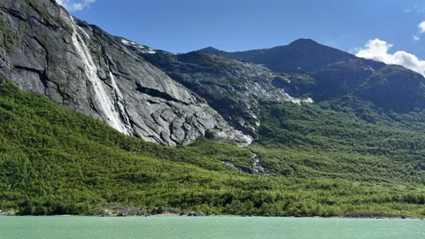 Mountains with a cascading waterfall Stock Footage 337364554